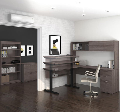 4-Piece set including a standing desk, a credenza desk with hutch, a lateral file cabinet, and a bookcase