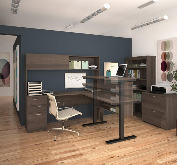 4-Piece set including a standing desk, a credenza desk with hutch, a lateral file cabinet, and a bookcase